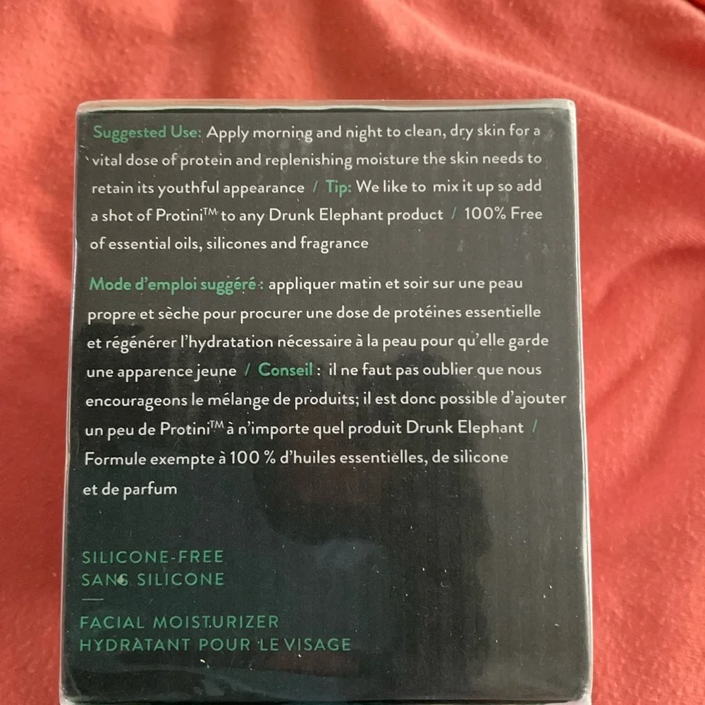Drunk Elephant Facial Moisturizer with Green Text